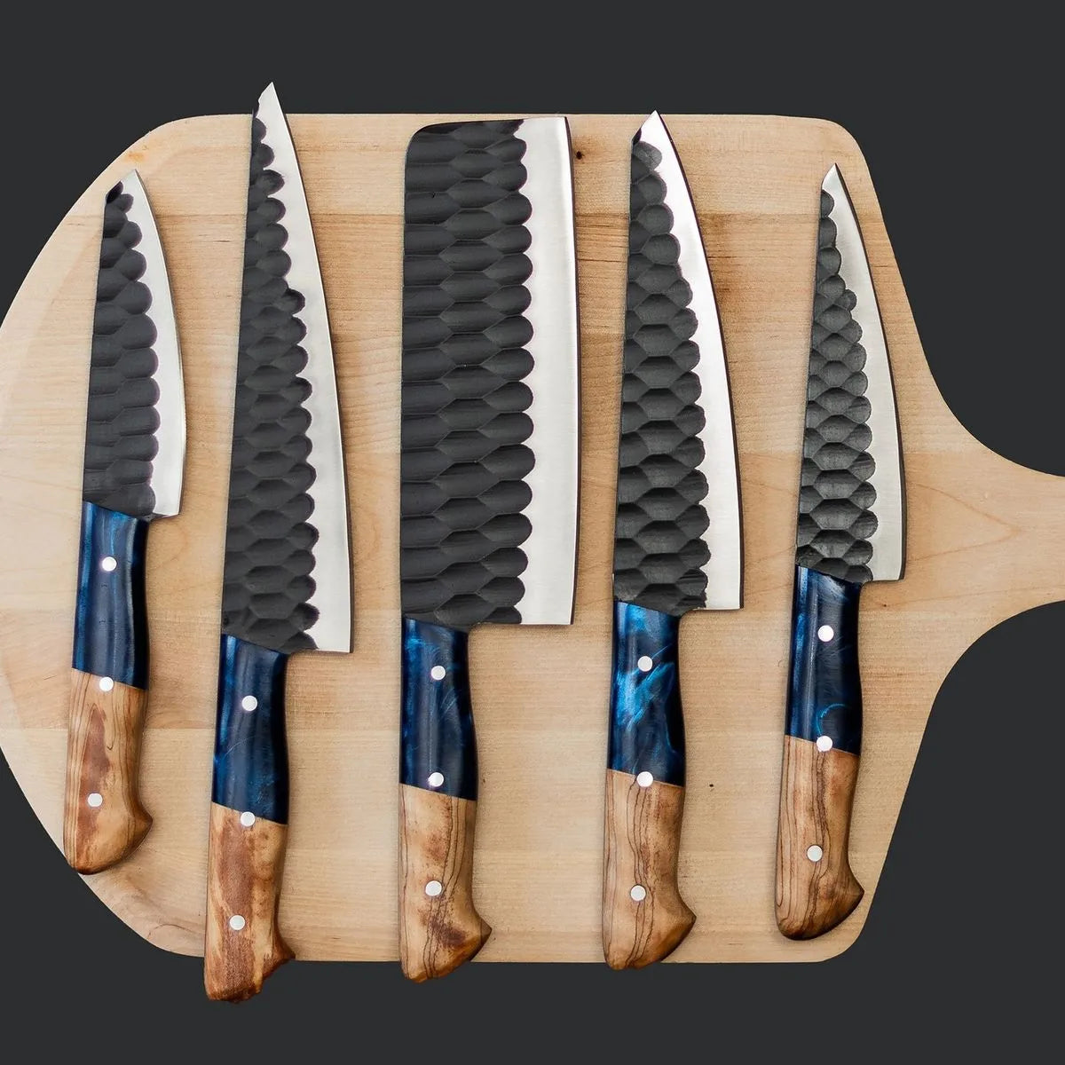 High-quality forged culinary knife collection showcasing superior craftsmanship and modern artistic design.