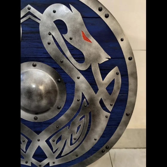 Handcrafted blue Viking dragon shield, angled display shot