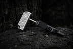 High-quality custom titanium push dagger EDC tool with a durable sheath, captured in a professional product photography style.