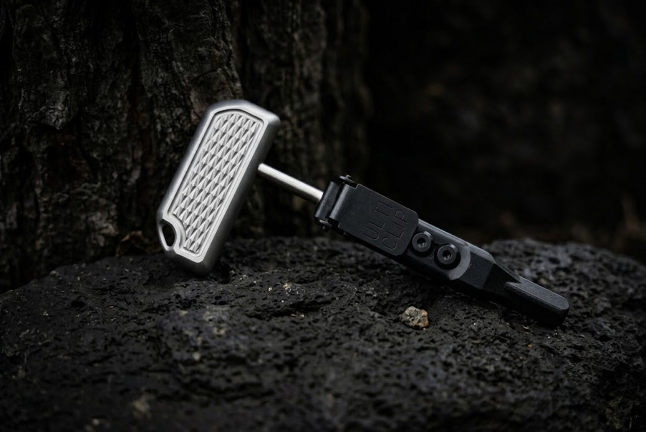 High-quality custom titanium push dagger EDC tool with a durable sheath, captured in a professional product photography style.
