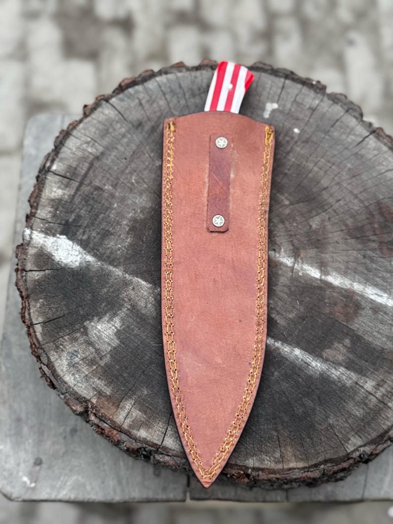 Hand-forged Damascus chef knife with red white and blue handle, collector's gift