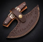 A handcrafted Damascus steel push dagger securely tucked inside a premium thick brown leather sheath, featuring decorative hand-stitched cross patterns, a heavy-duty retaining strap, and a brass snap button closure.