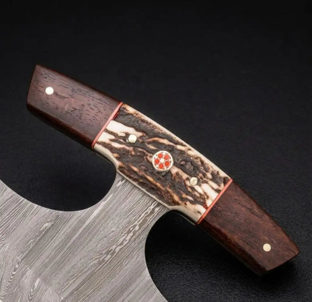 Premium custom Damascus hunting knife featuring an ergonomic antler and exotic wood handle handle with intricate mosaic pin detailing and wavy steel blade patterns for weapon collectors.