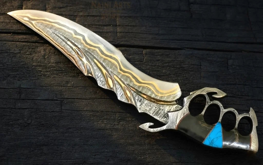 A professional full studio shot of a handmade Damascus steel fantasy medieval dagger featuring a skeleton knuckle-duster handle embedded with a vibrant turquoise stone on a dark wooden surface
