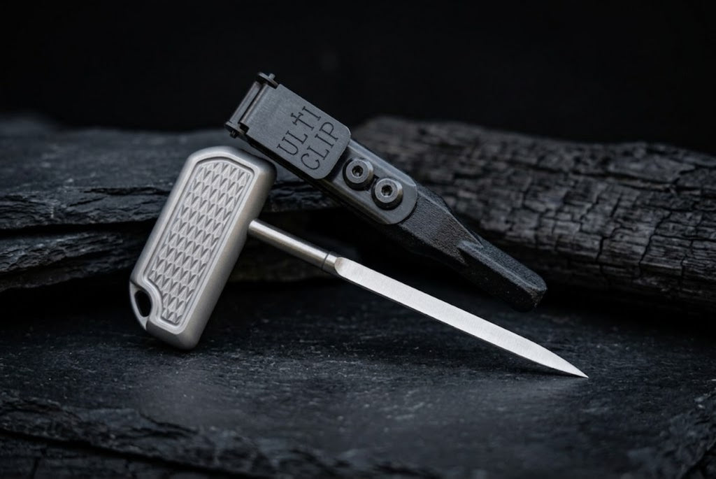 Custom titanium push dagger displayed with its matching UltiClip sheath, showcasing premium EDC gear design.