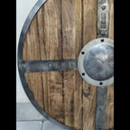 Handcrafted medieval shield displayed as wall decor